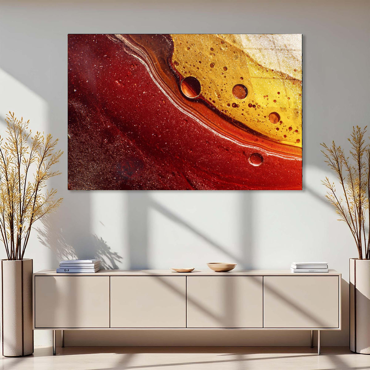 Abstract art piece on a wall above a modern console table with decorative elements.