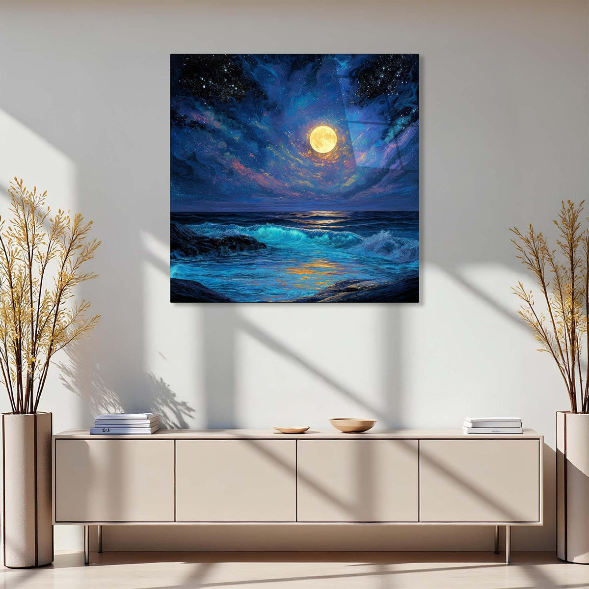 Modern interior with a large painting of a moonlit sea above a light-colored cabinet.