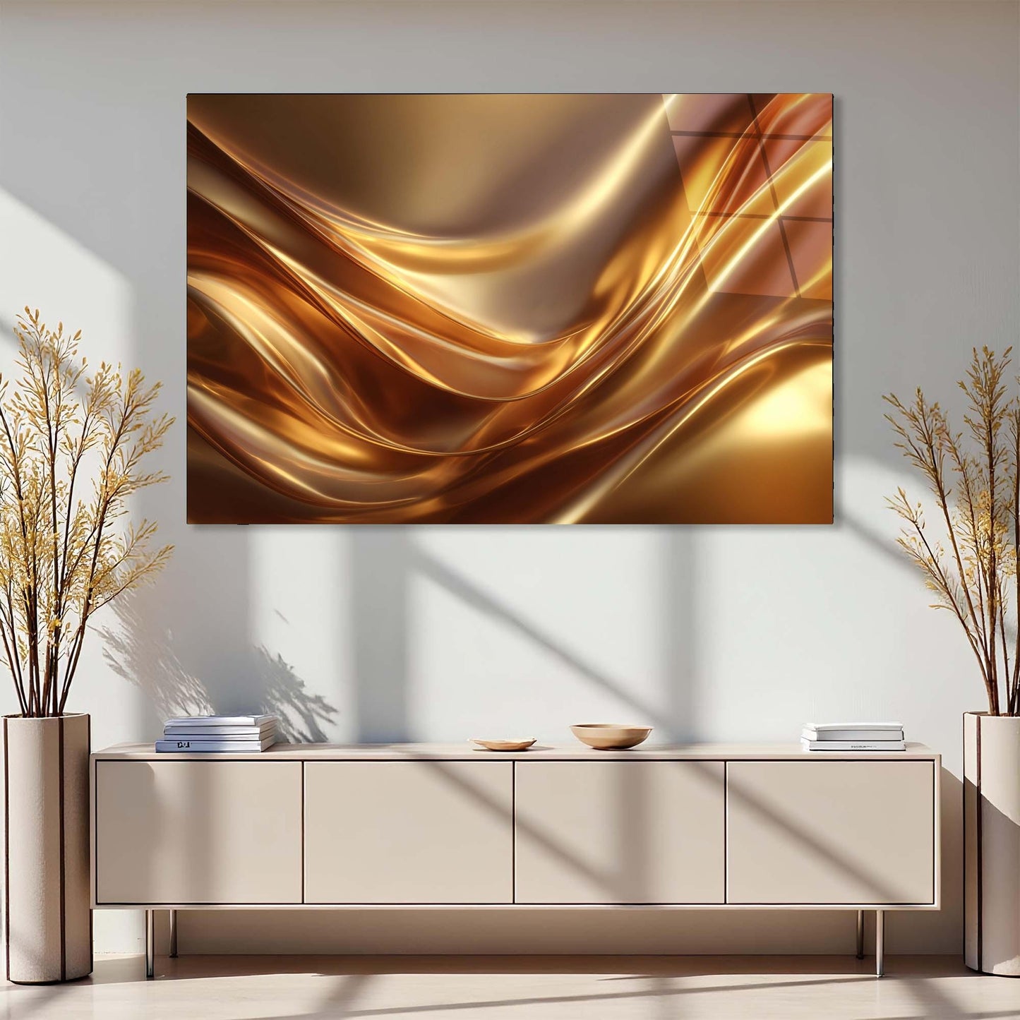 Abstract gold painting on a wall above a light-colored cabinet with decorative plants on either side.