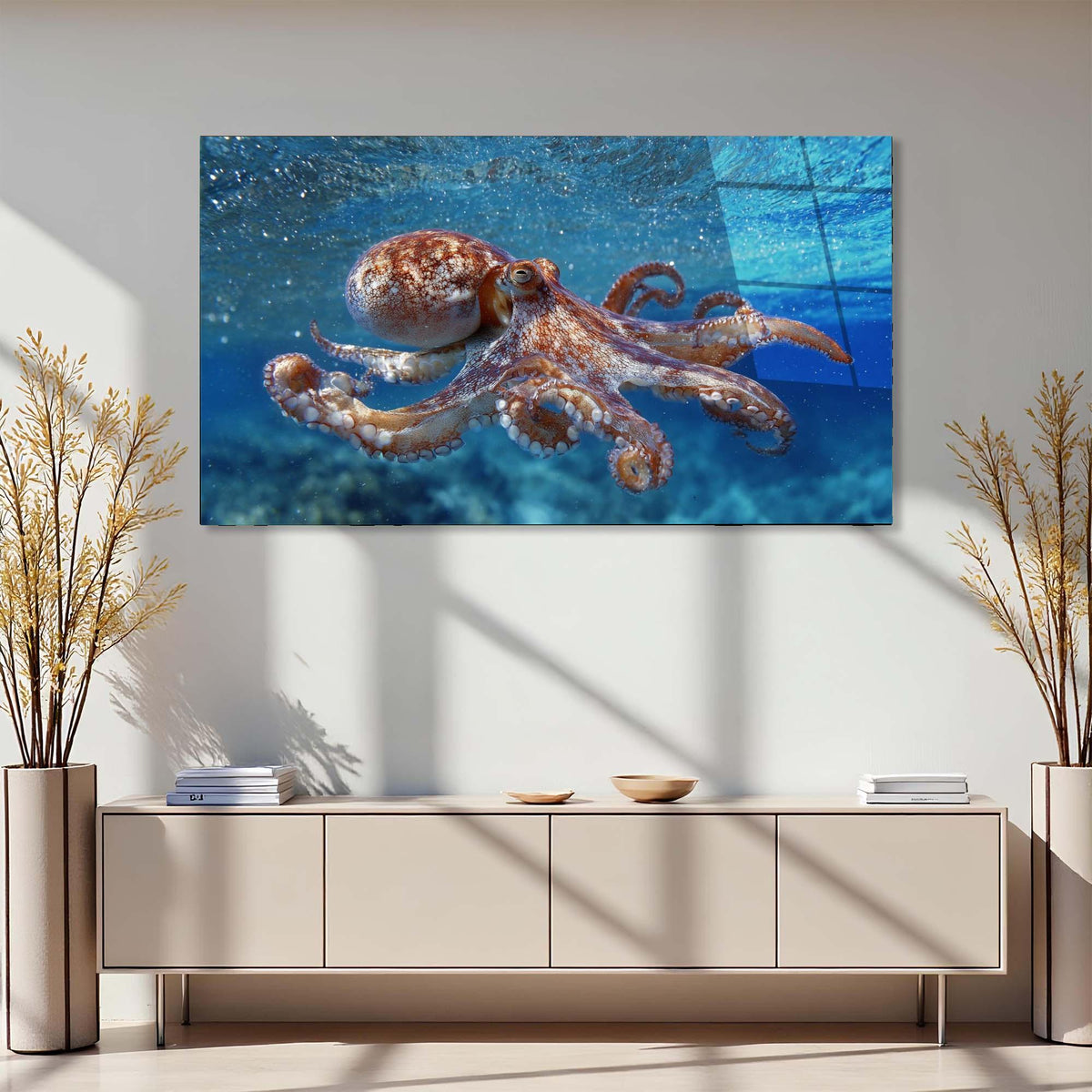 Modern interior with a large octopus painting on the wall above a light-colored cabinet.