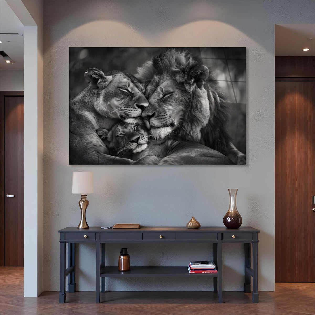 Framed black and white artwork of a lion and lioness on a wall above a console table.