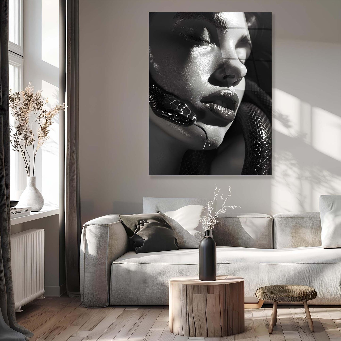 Modern living room with a large wall art piece of a woman's face.