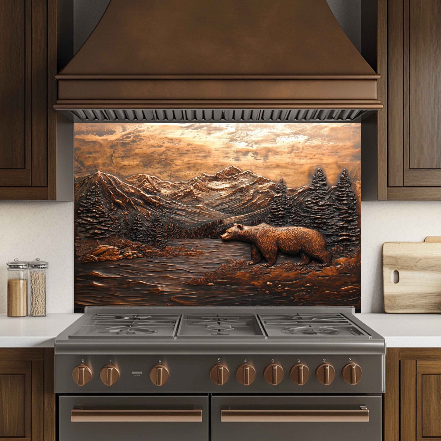 Stainless steel stove with decorative mountain and bear design on the back splash in a kitchen setting.