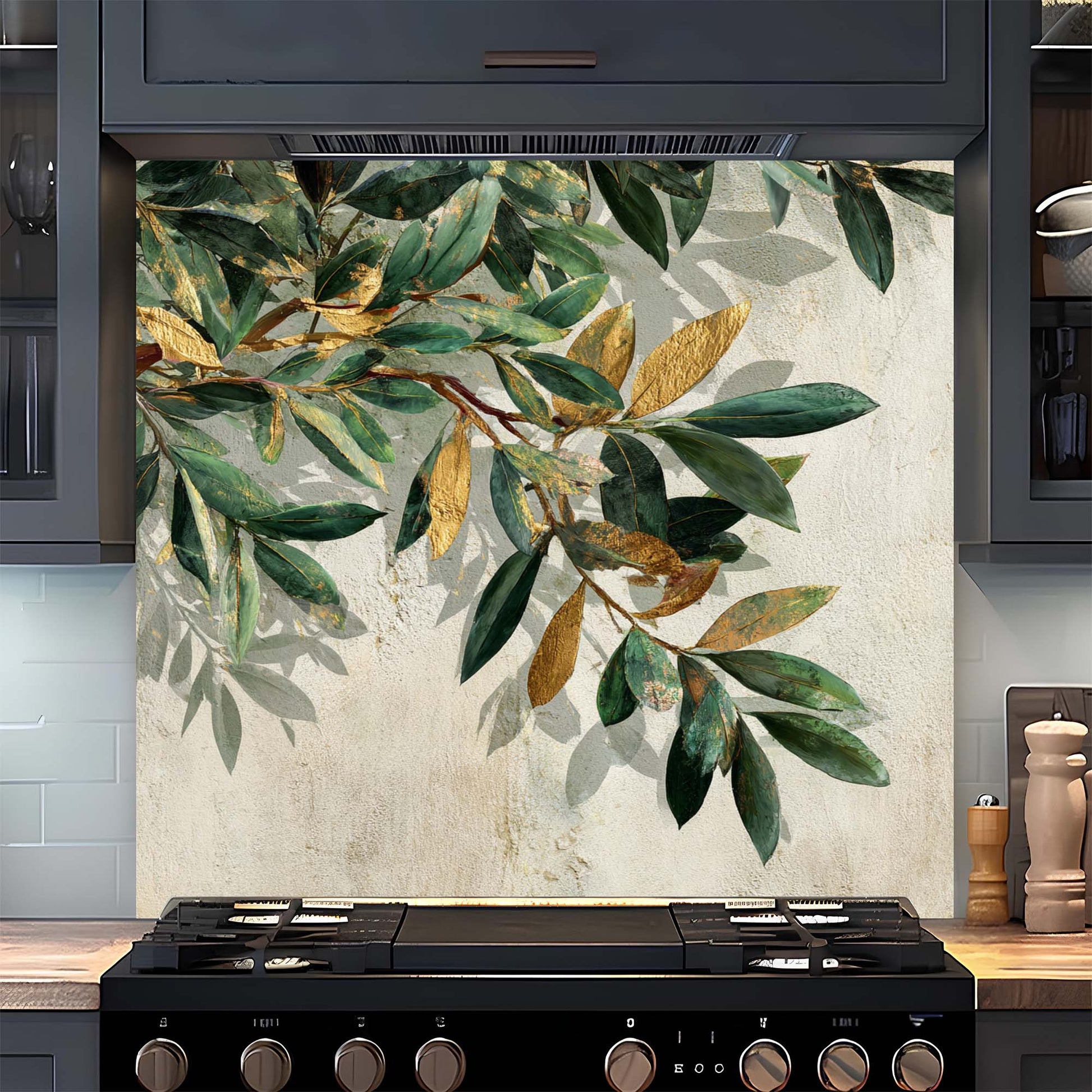 Decorative glass backsplash with green and gold leaves in a kitchen setting