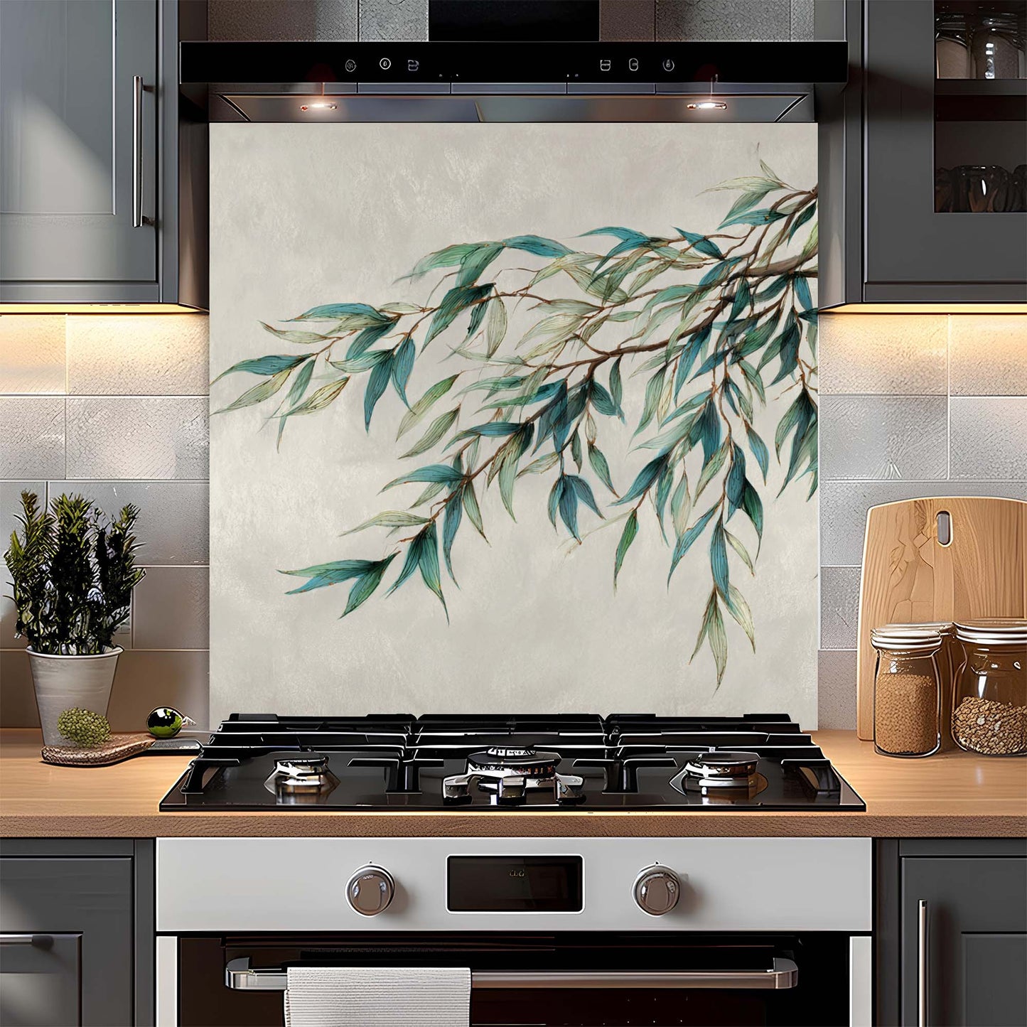 Modern kitchen with a decorative backsplash featuring green leaves.