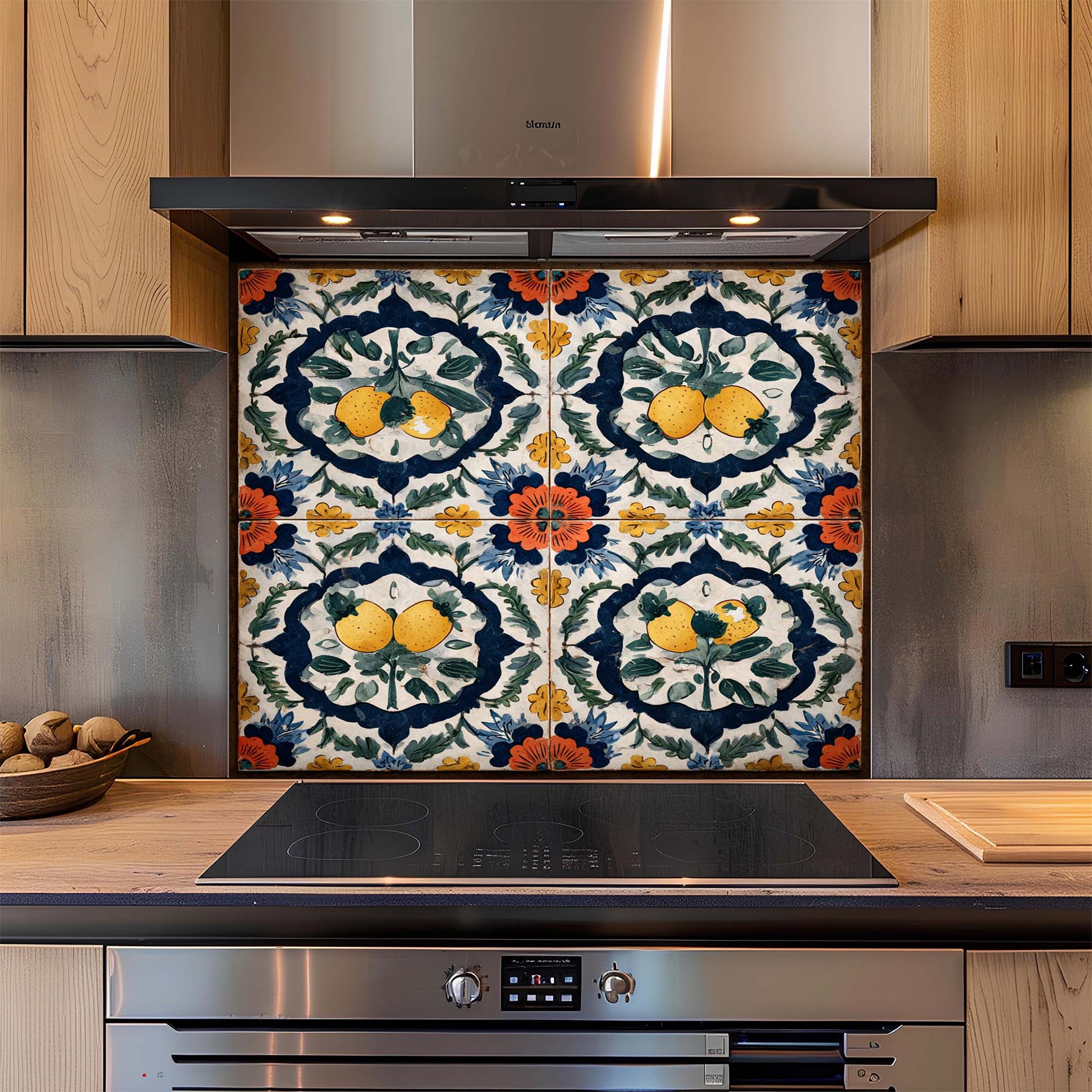 Decorative splashback with floral and fruit pattern above a kitchen stove.