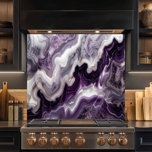 Stainless steel stove with a purple and white marbled backsplash in a kitchen setting.