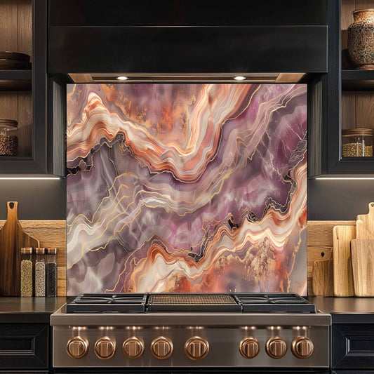 Stainless steel stove with a decorative glass panel featuring swirling colors in a kitchen setting.