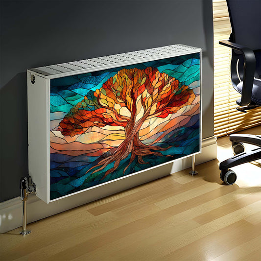 Decorative radiator cover with a colorful tree design in a room with a chair.