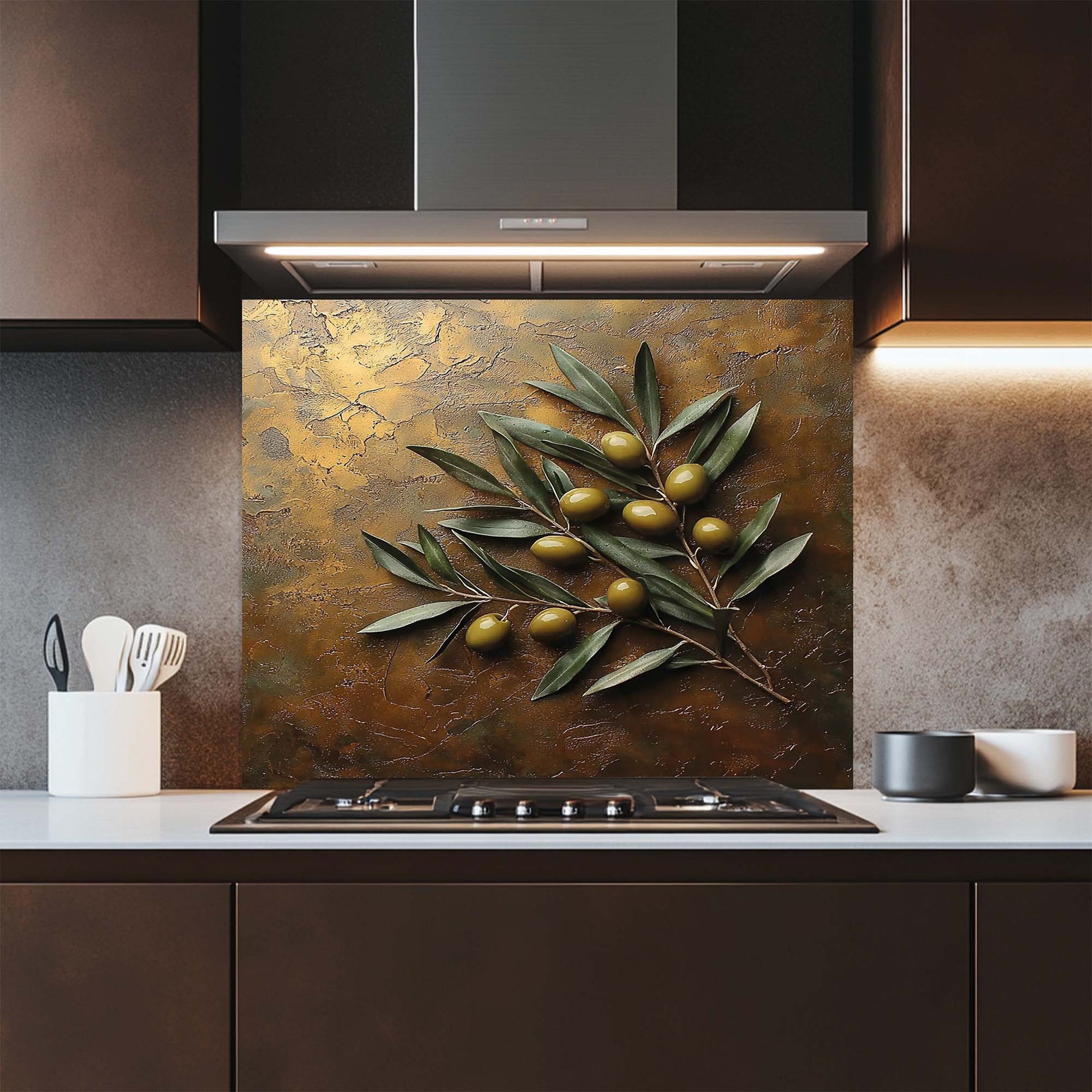 Kitchen with a decorative glass backsplash featuring olive branches and olives.