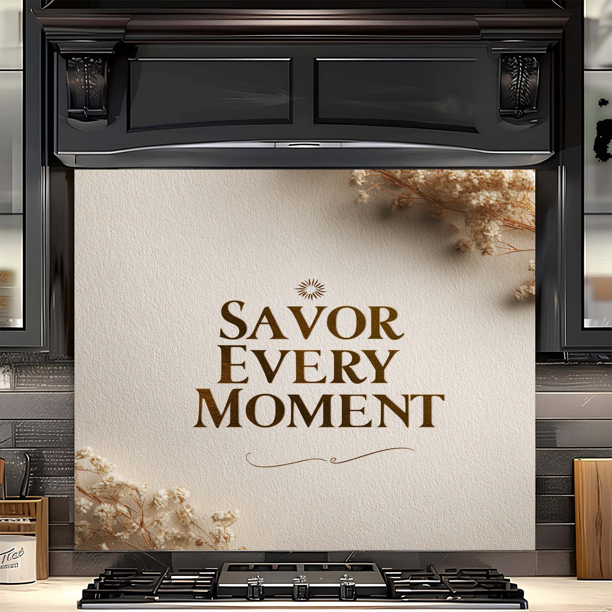 Stove with decorative glass backsplash featuring 'Savor Every Moment' text in a kitchen setting