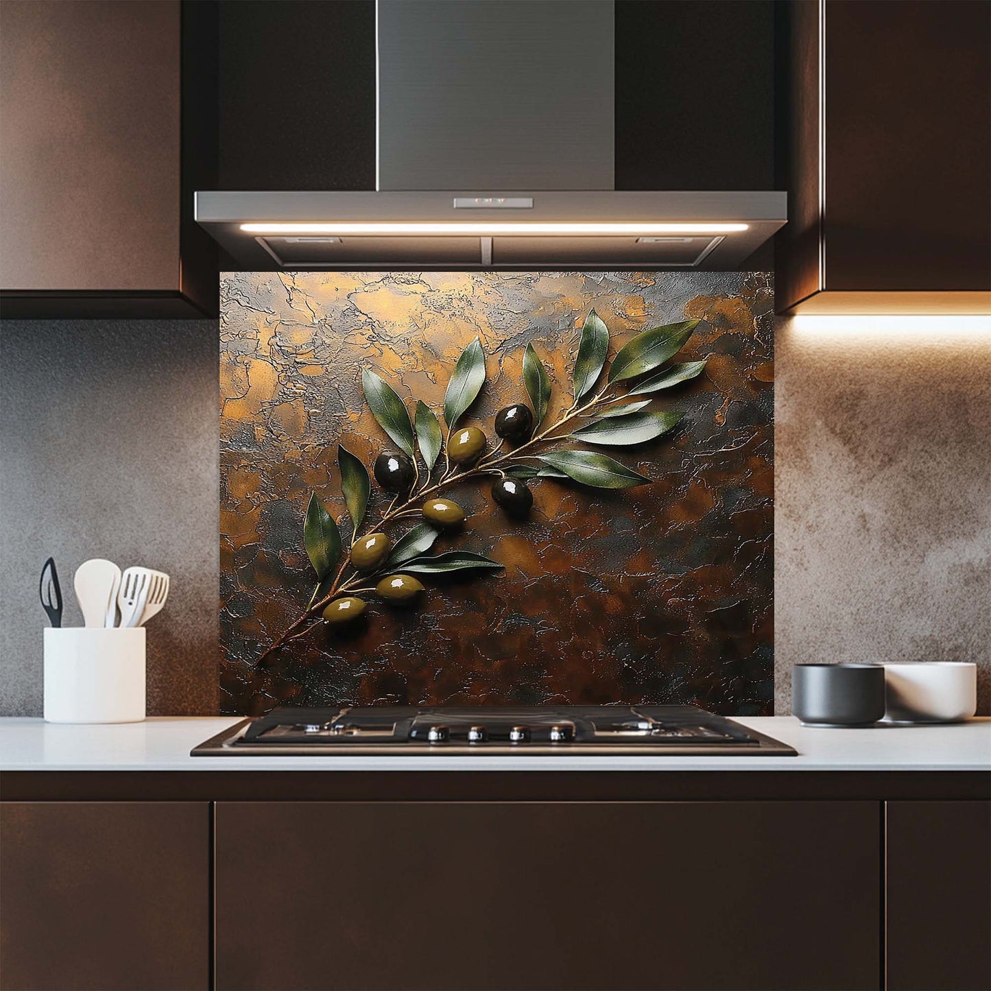 Modern kitchen with decorative glass backsplash featuring leaves and olives.