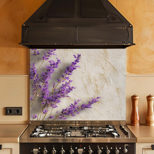 Stainless steel stove with decorative glass splashback featuring purple flowers and beige stone pattern.