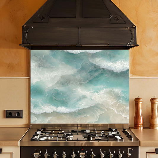 Kitchen stove with a decorative glass backsplash featuring ocean waves.