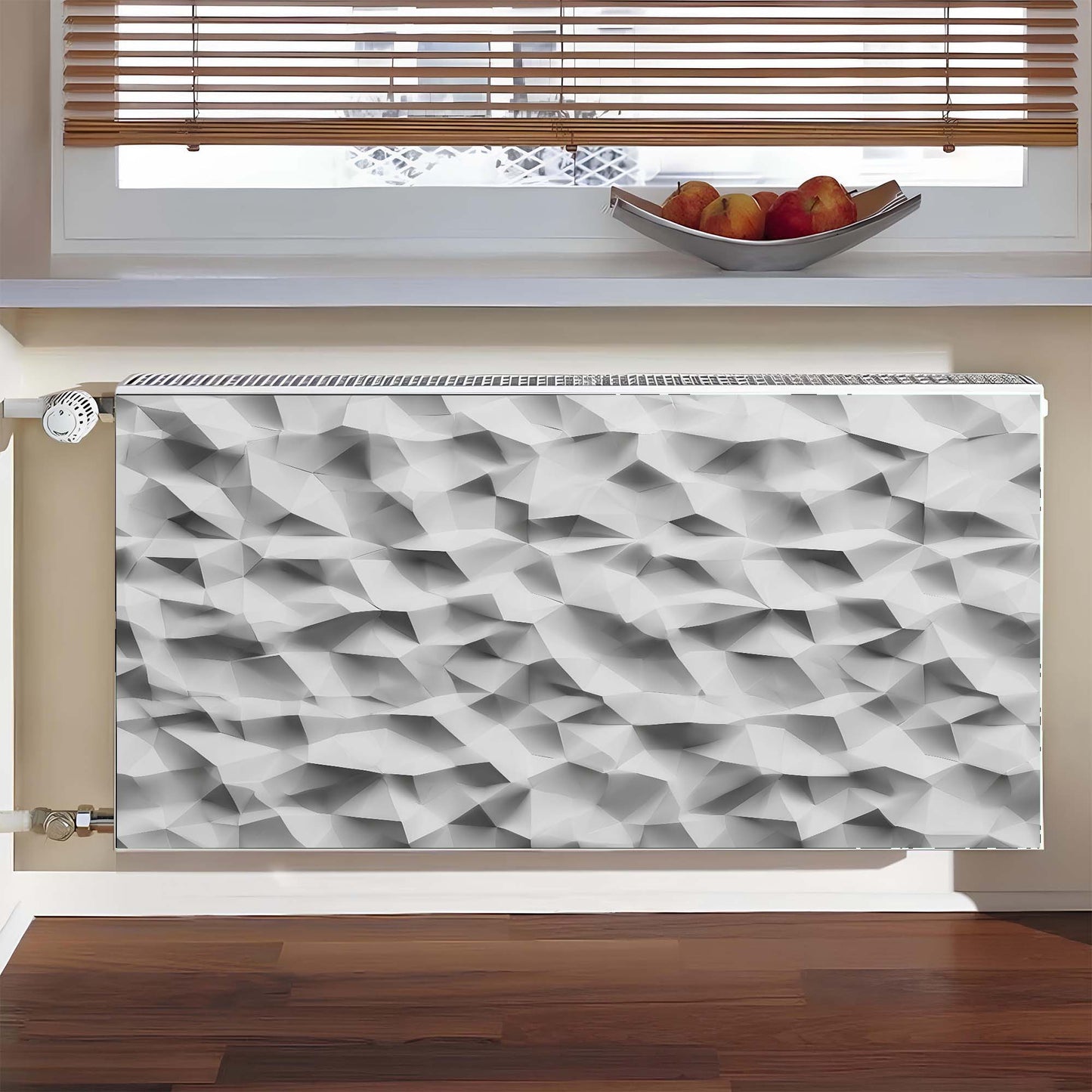 Decorative magnetic radiator cover with geometric pattern in a room with a window and fruit bowl.
