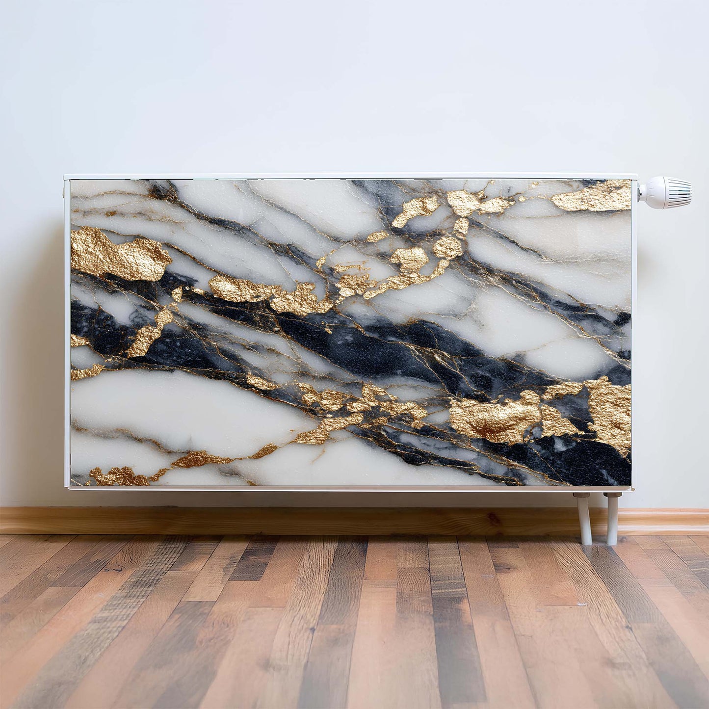Marble-patterned magnetic radiator cover with gold accents on a wooden floor.