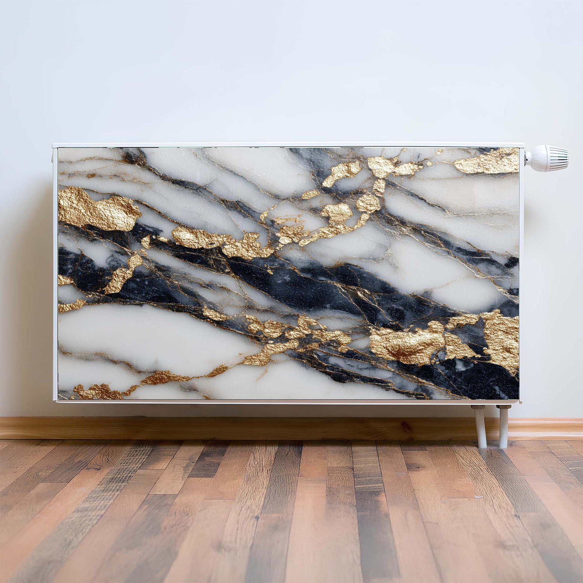 Marble-patterned magnetic radiator cover with gold accents on a wooden floor.