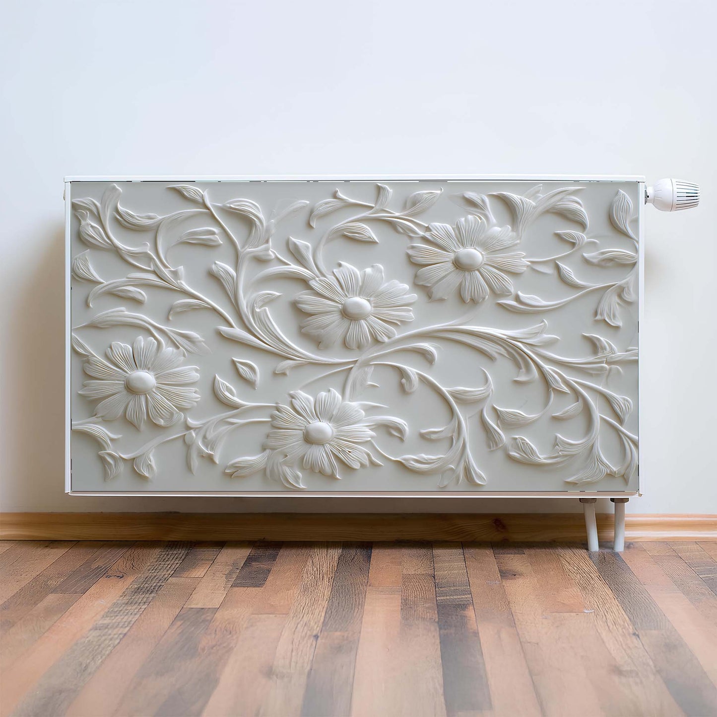 Decorative magnetic radiator cover with floral patterns on a wooden floor and light-colored wall.