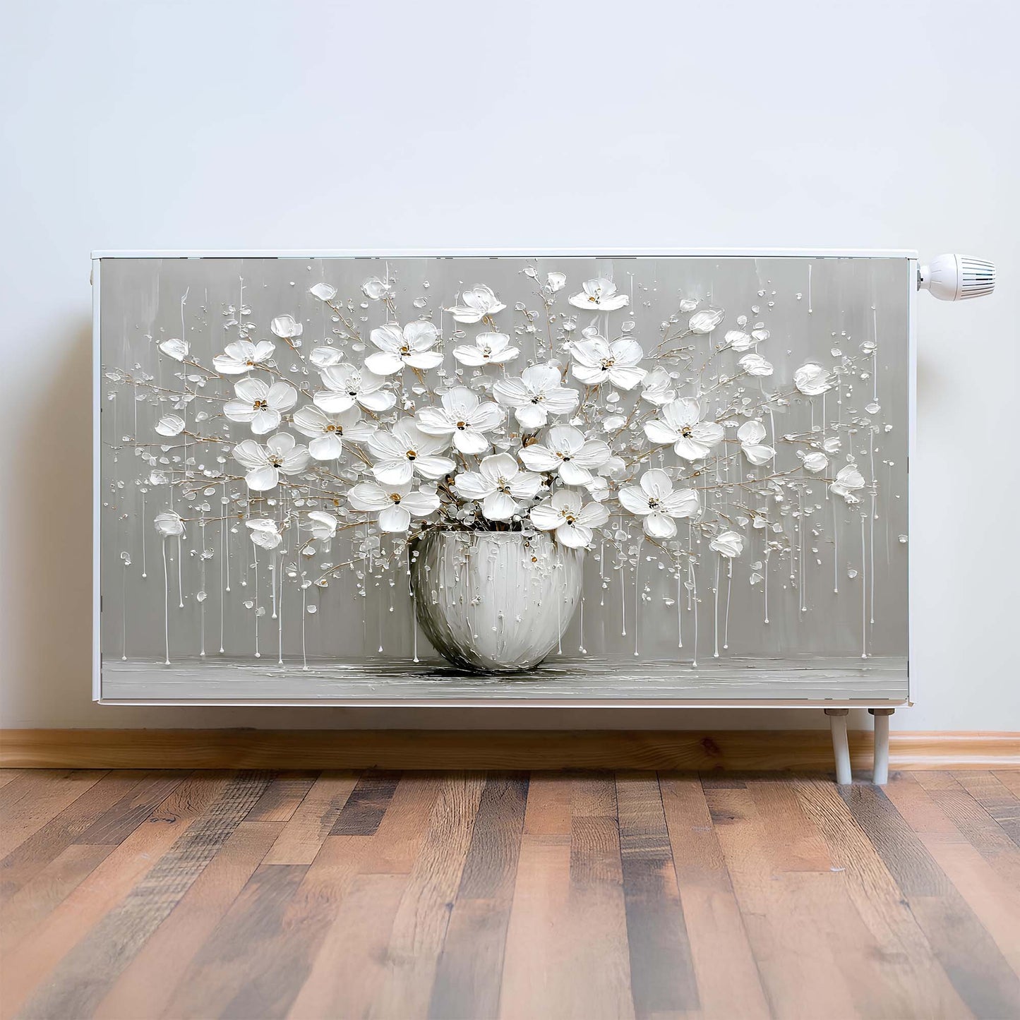 Decorative magnetic radiator cover with a floral design on a plain wall.