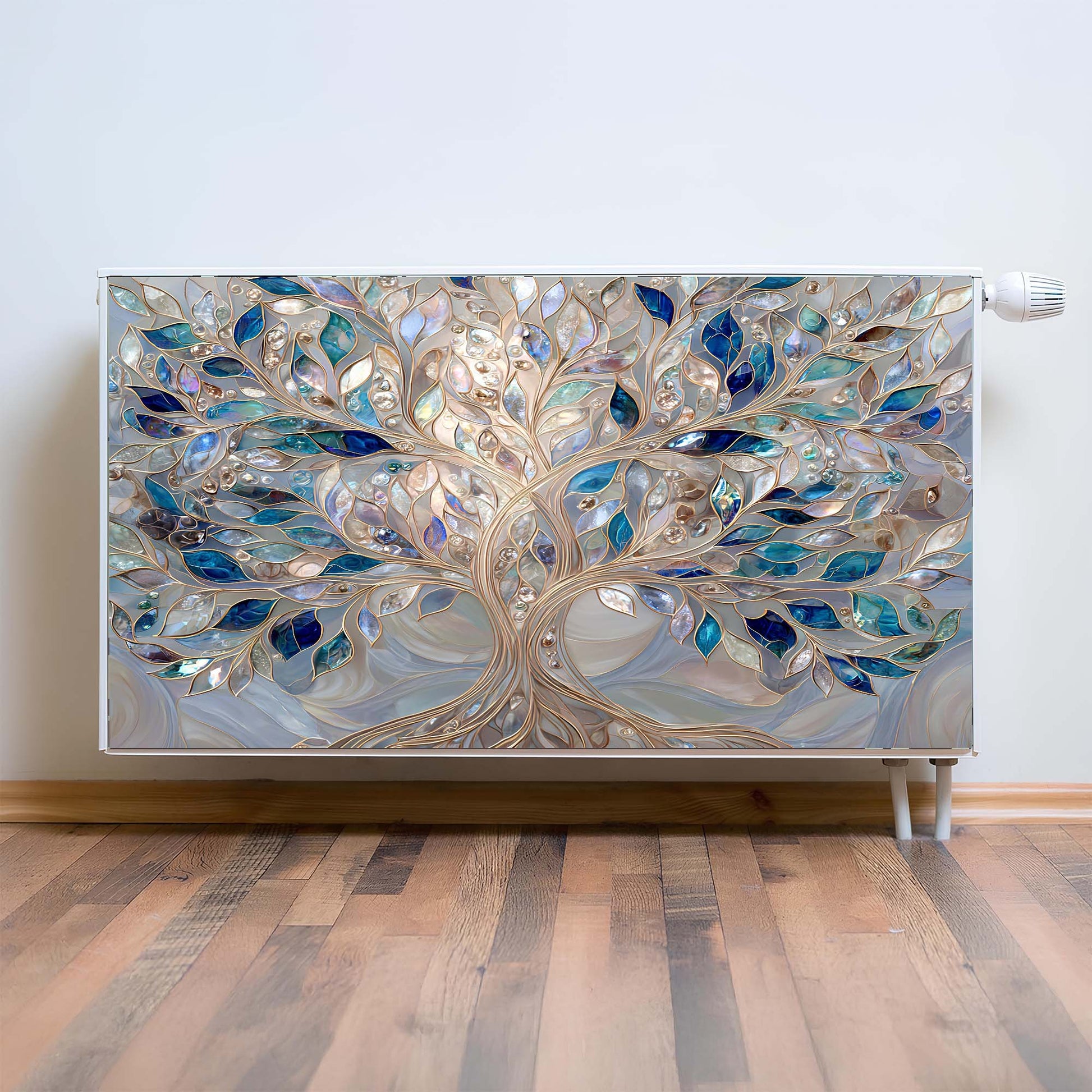 Decorative magnetic radiator cover with a tree design on a wall.