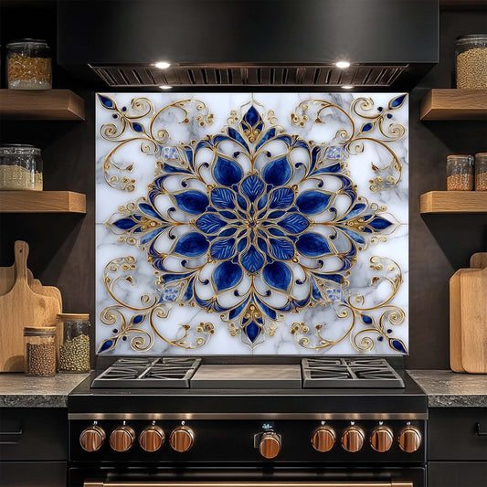 Decorative glass backsplash with blue and gold floral pattern above a stove in a kitchen.