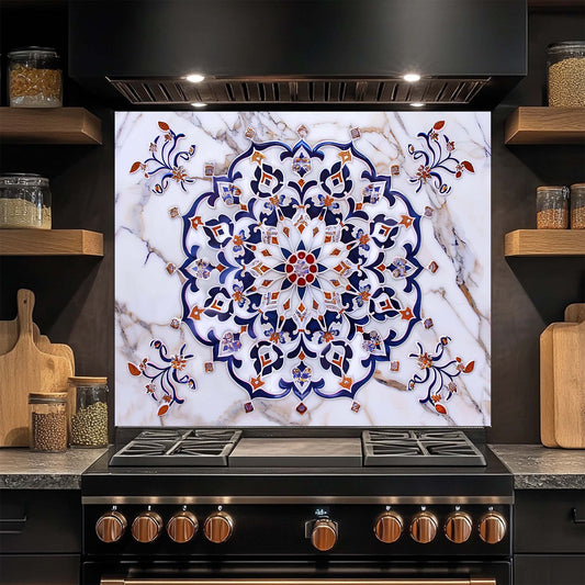 Decorative glass backsplash with intricate pattern above a stove in a kitchen.