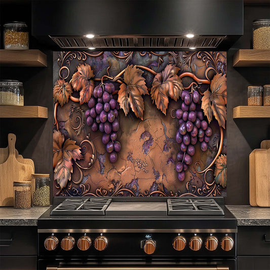 Decorative glass backsplash with grapes and leaves above a stove in a kitchen.