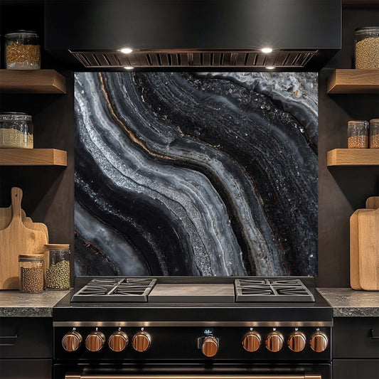 Modern kitchen with a black stove and glass splashback