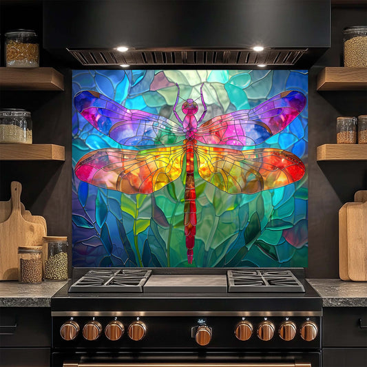 Colorful dragonfly design on a kitchen glass backsplash above a stove.