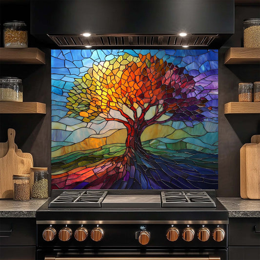 Colorful stained glass-style tree design on a kitchen backsplash above a stove.
