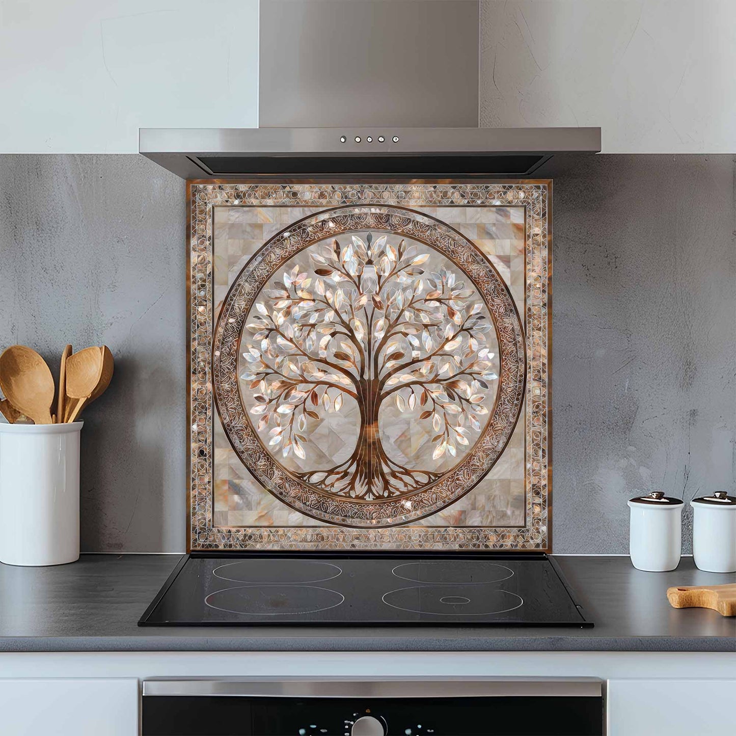 Decorative glass backsplash with a tree design above a stove in a kitchen.