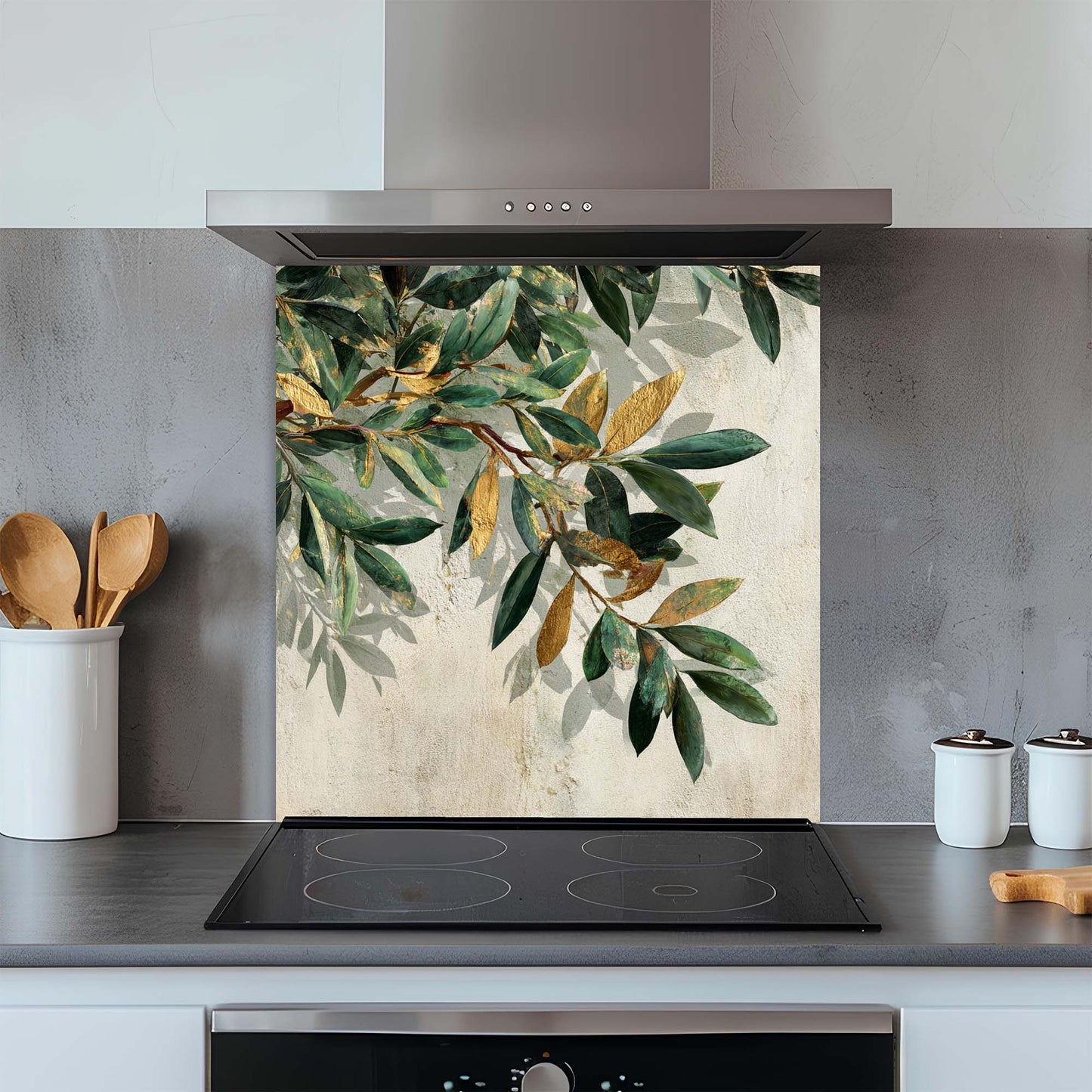 Kitchen glass backsplash with leaf design above a stove