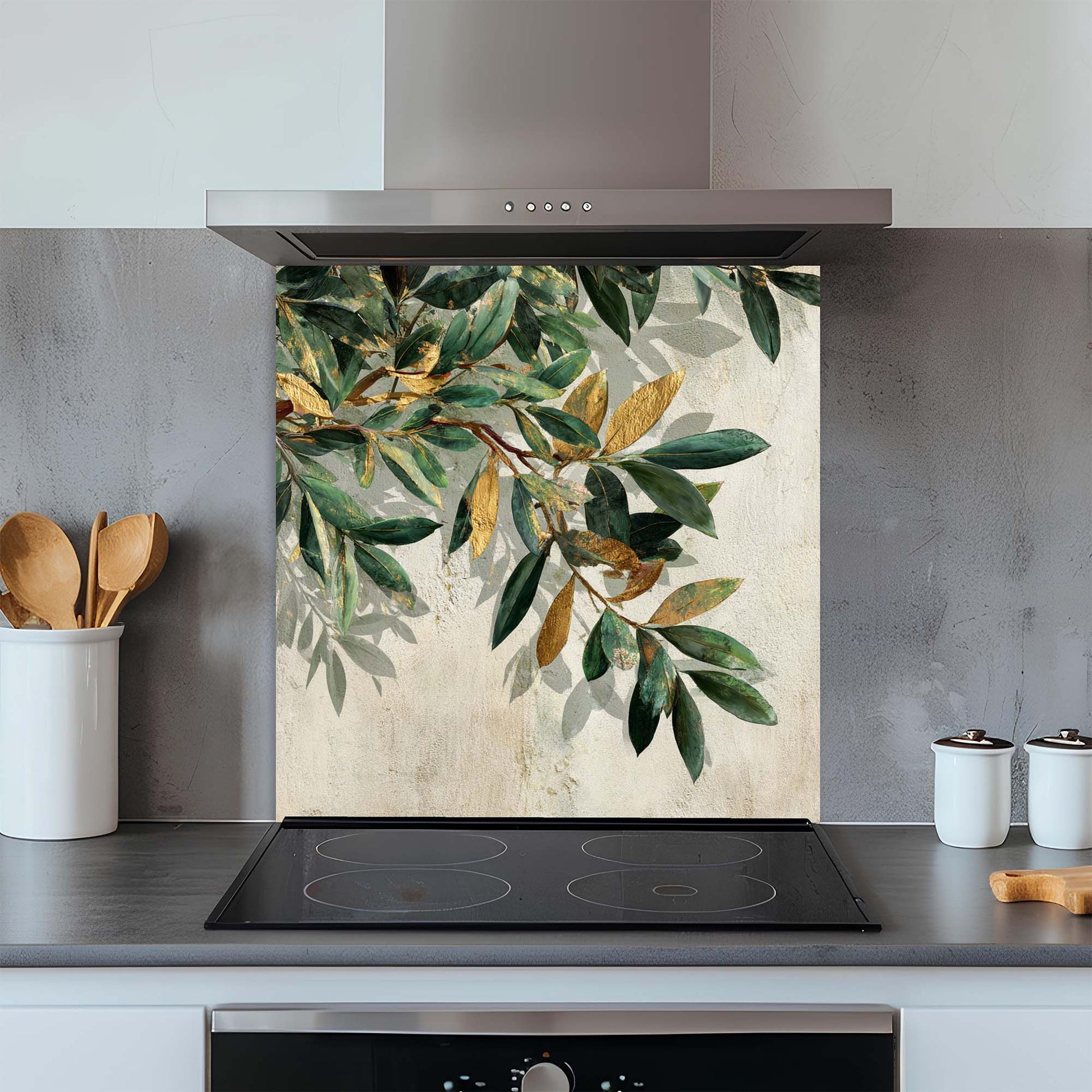 Kitchen glass backsplash with leaf design above a stove