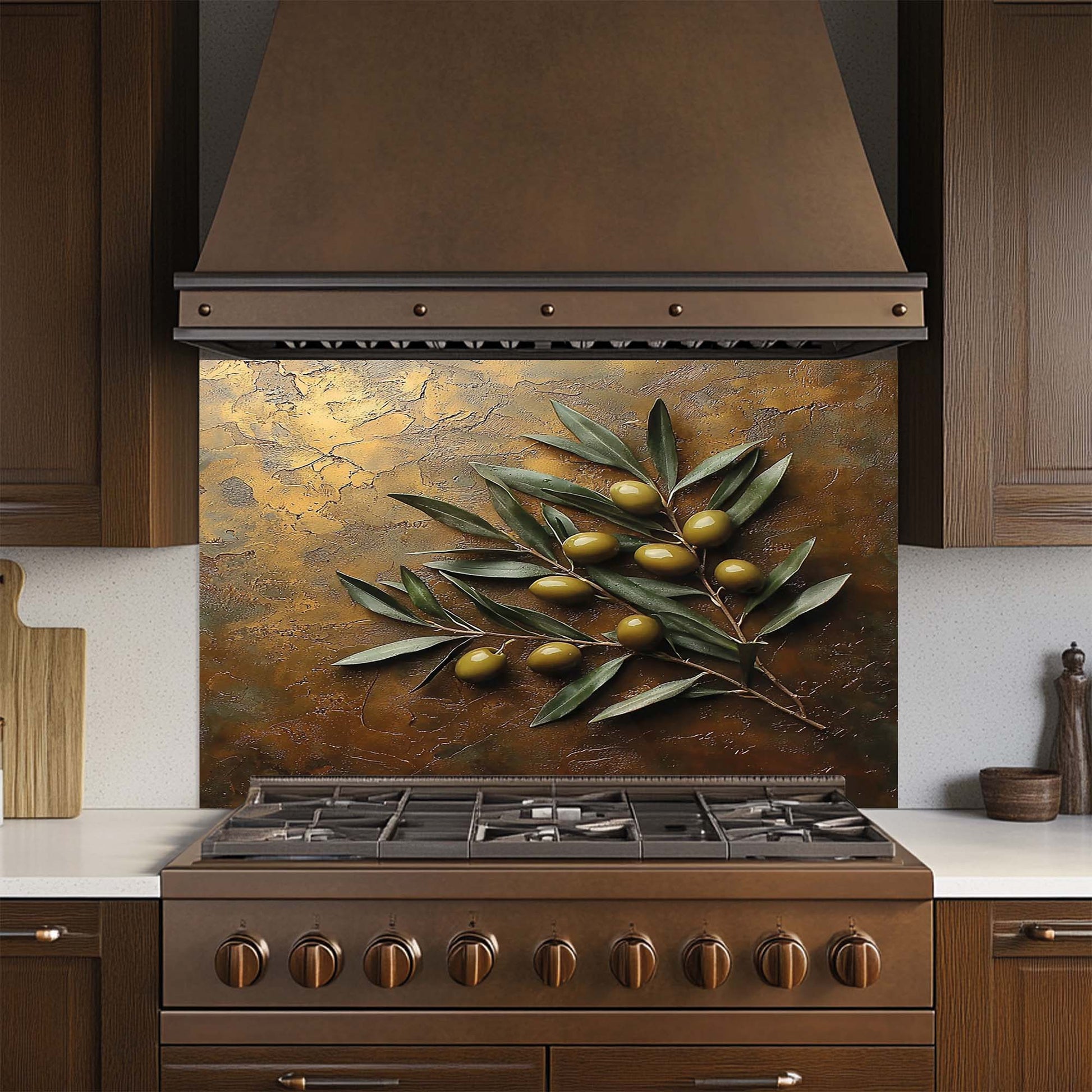 Stainless steel stove with decorative glass backsplash featuring olive branch design in a kitchen setting.