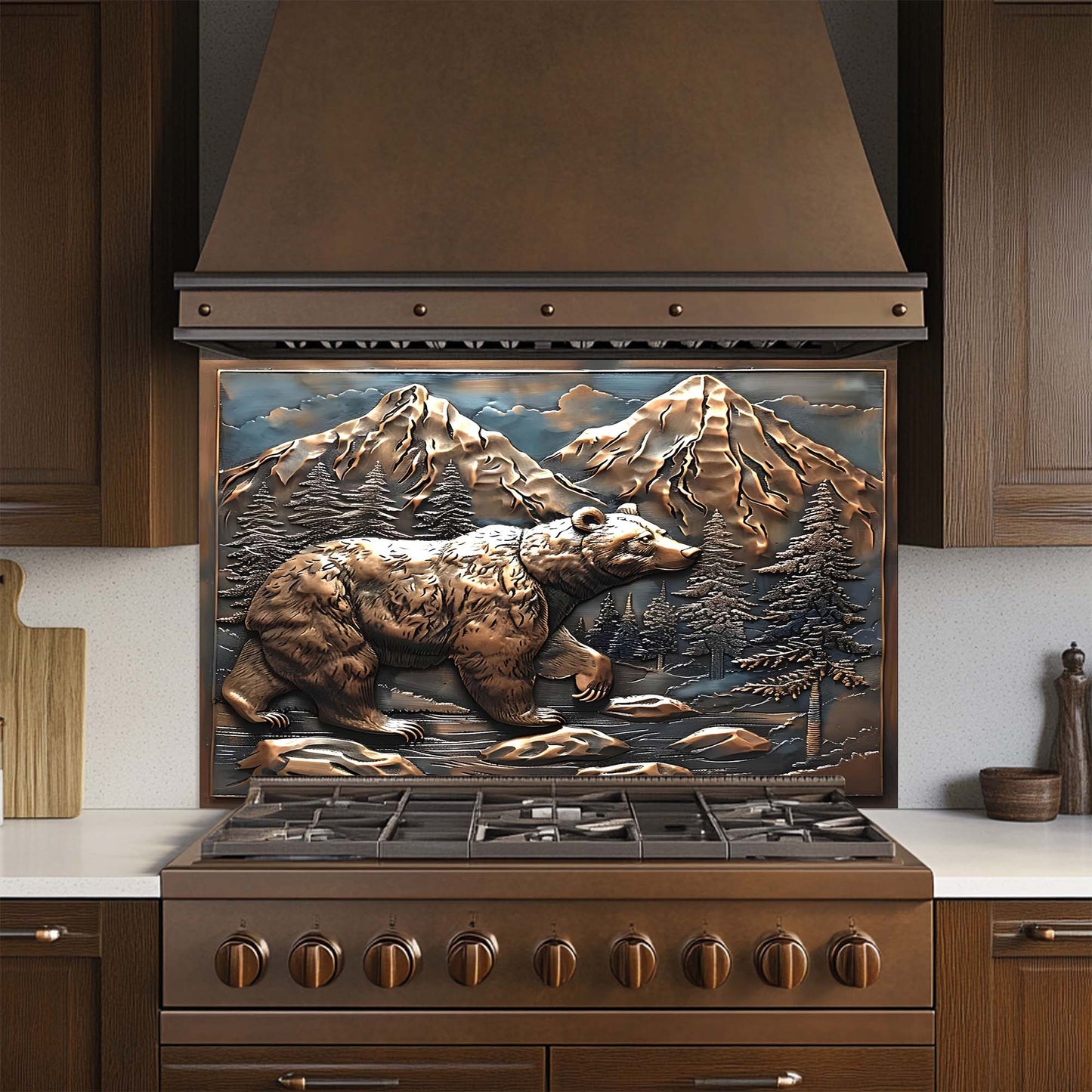 Stainless steel stove with decorative mountain and bear design on the glass backsplash in a kitchen setting.