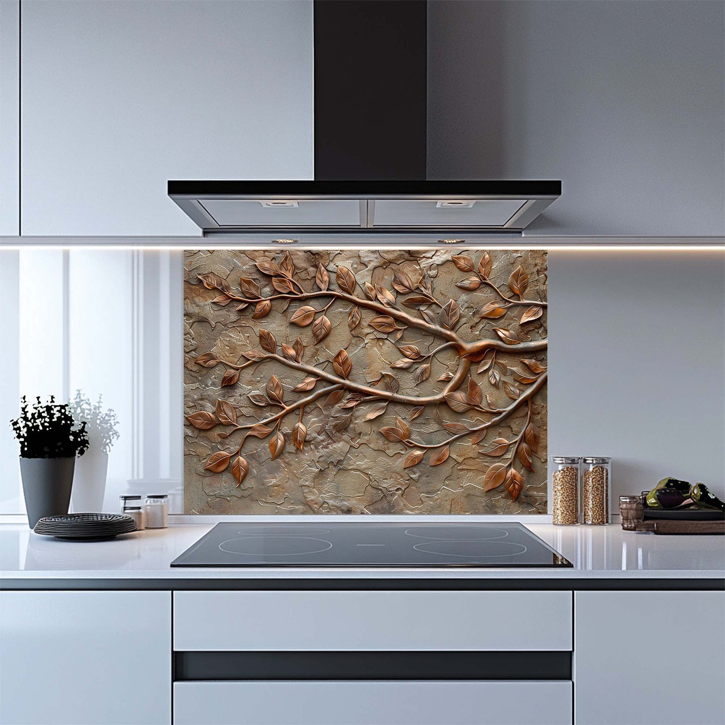 Kitchen with a decorative glass backsplash featuring branches and leaves.