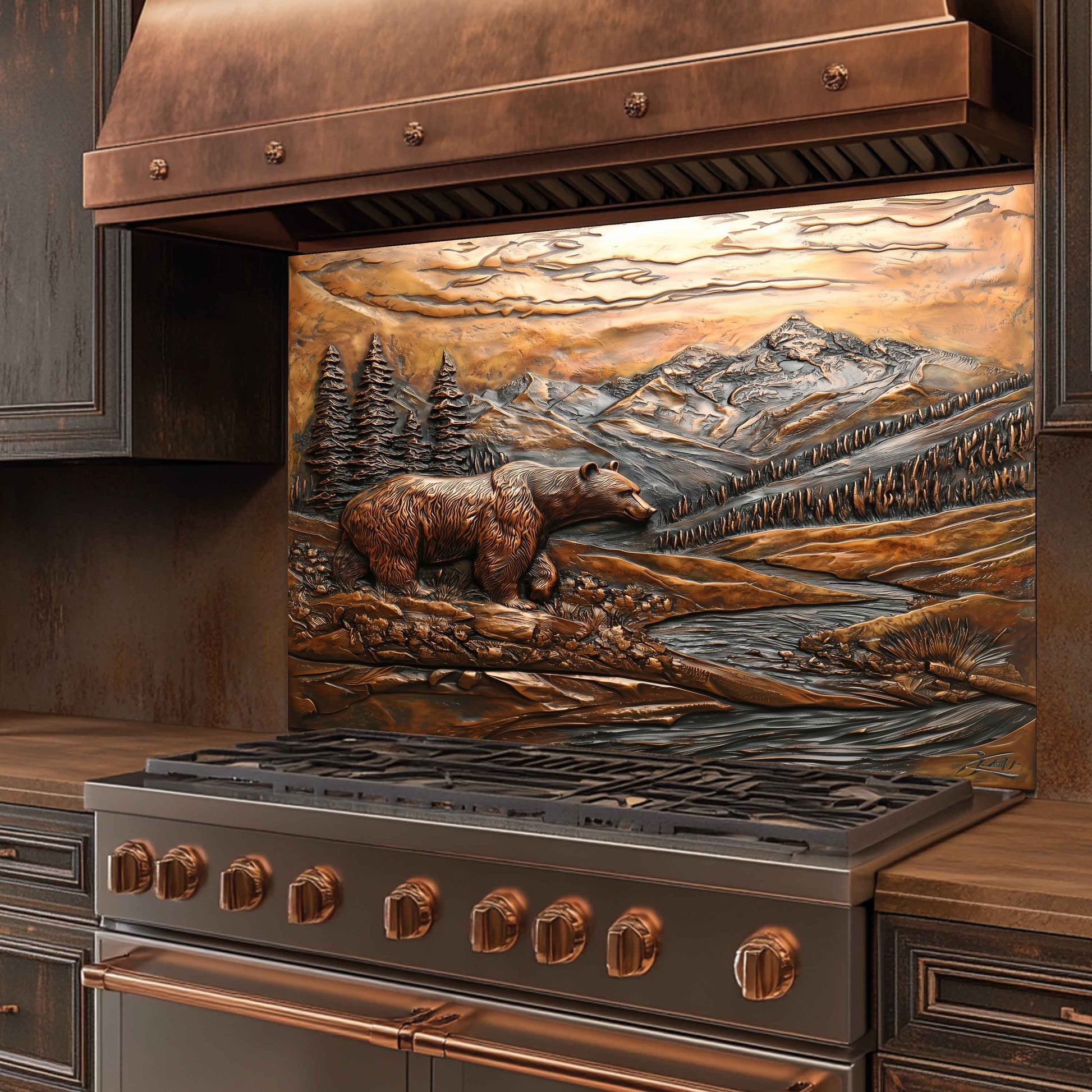 Stainless steel stove with copper accents and a bear and mountain design on the back splash.