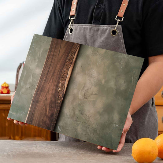 Person holding glass cutting boards with a kitchen background