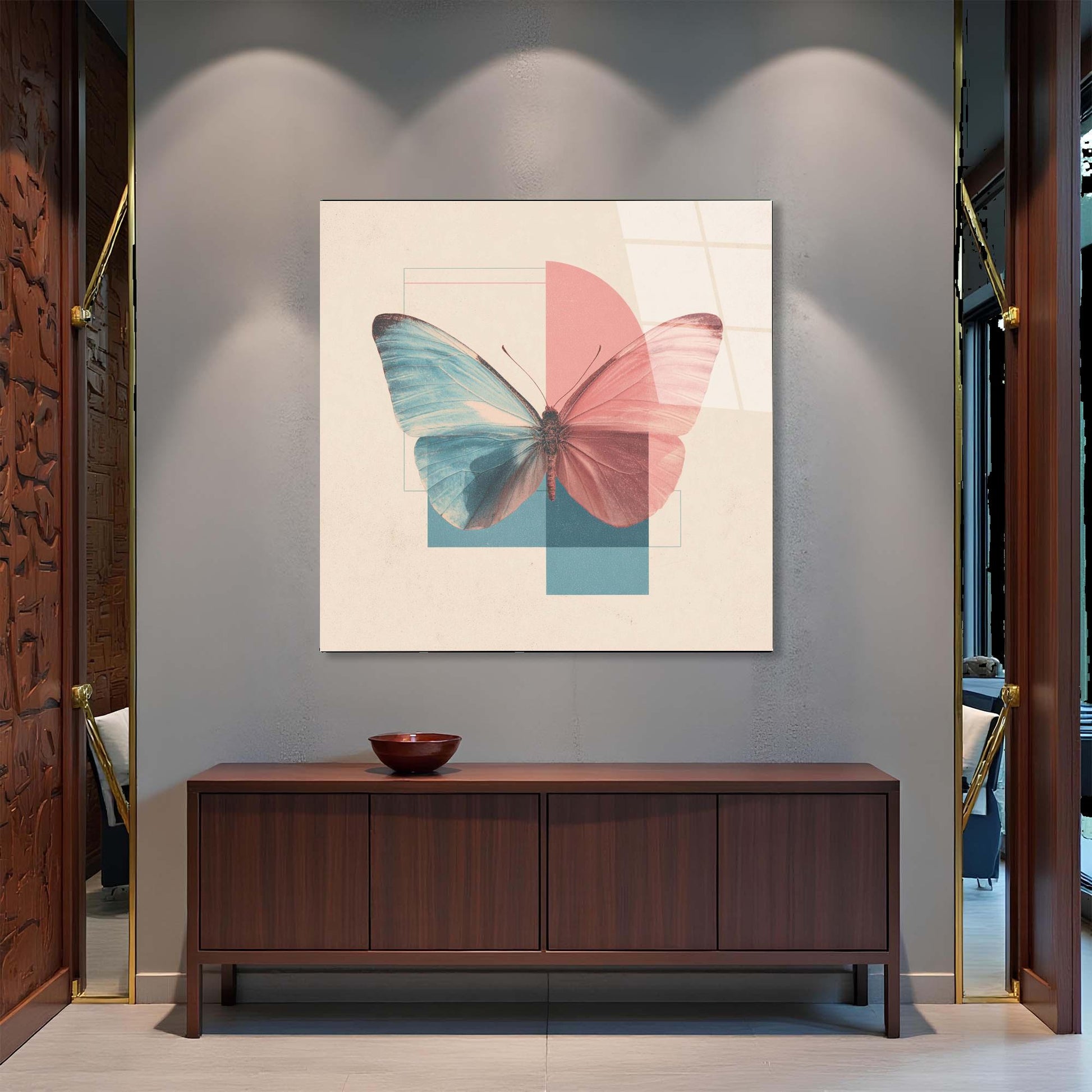 Butterfly artwork on a wall above a wooden cabinet