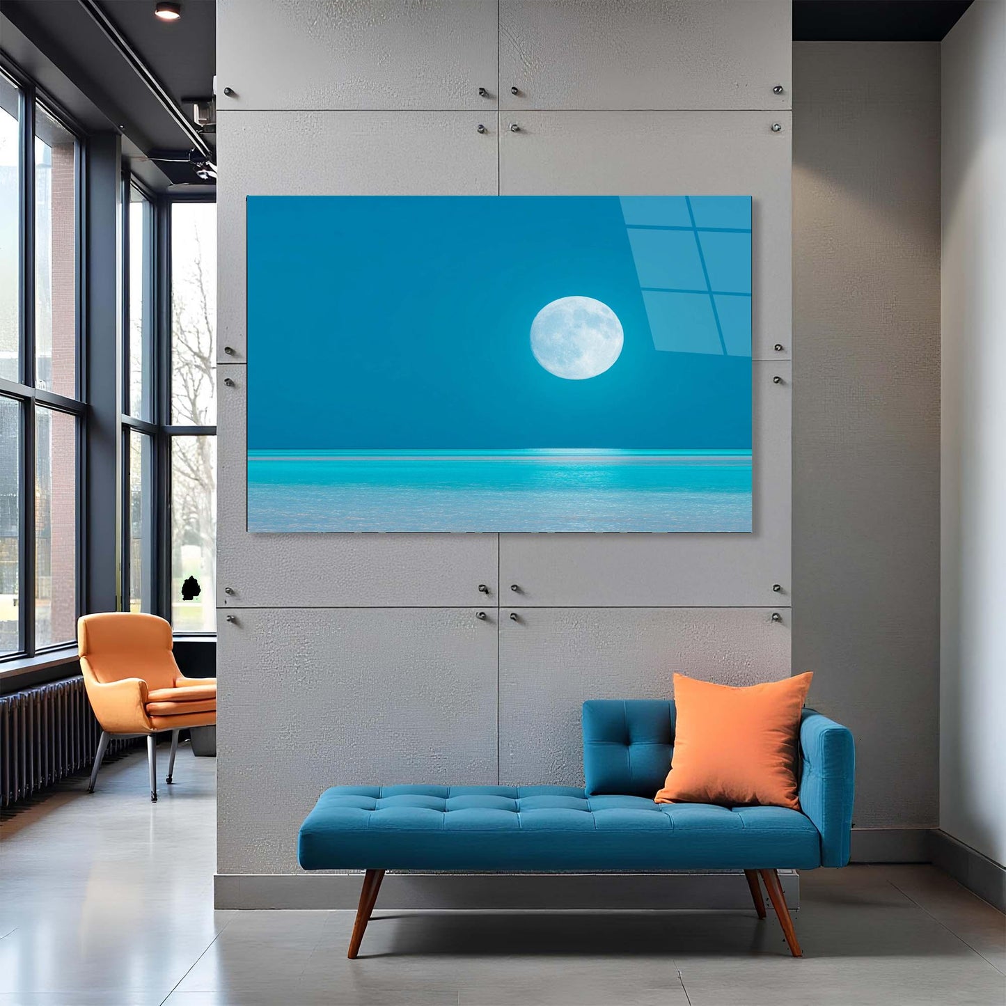 Modern interior with a blue sofa, orange chair, and a large wall-mounted TV displaying a moonlit scene.