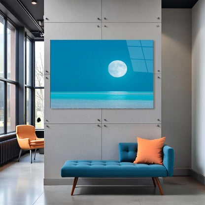 Modern interior with a blue sofa, orange chair, and a large wall-mounted TV displaying a moonlit scene.
