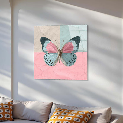 Butterfly artwork on a wall above a sofa with decorative pillows.