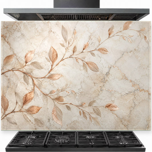 Copper branches design on a tempered glass kitchen backsplash panel installed behind a modern gas range stove.