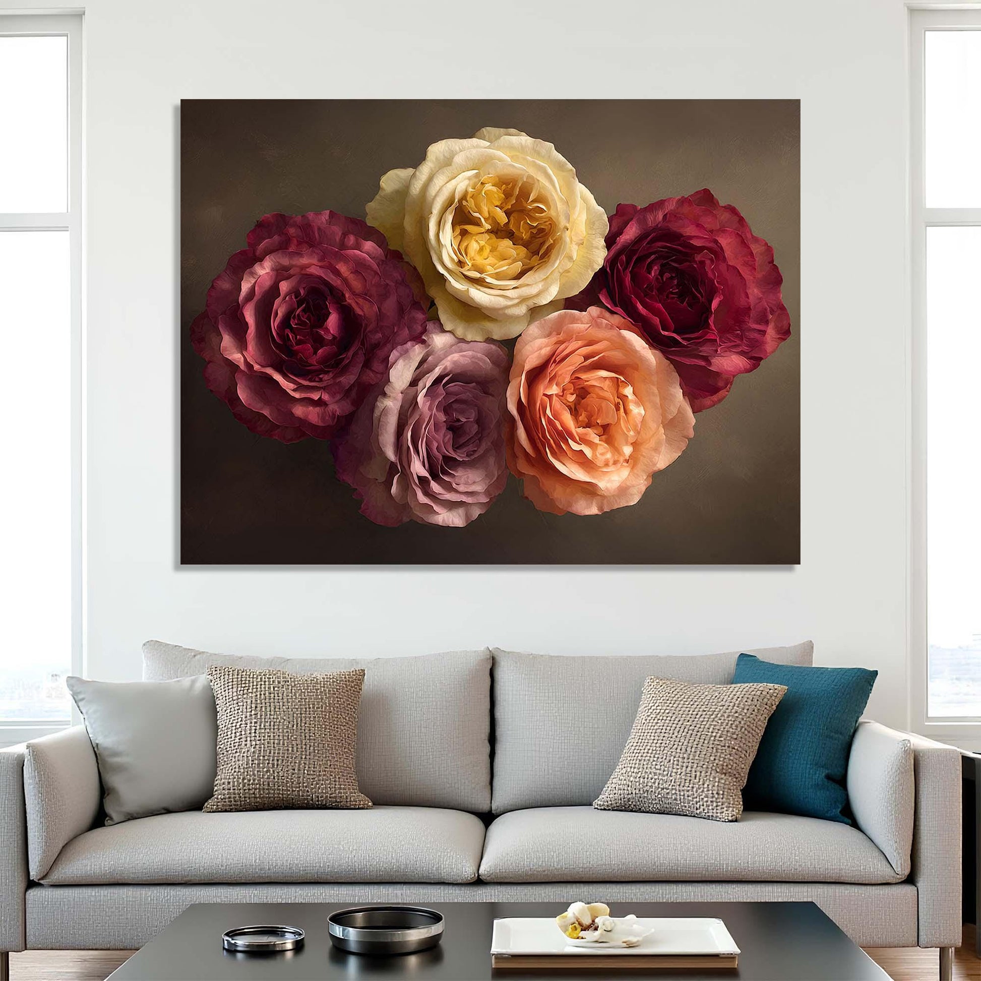 Floral painting above a gray sofa with decorative pillows