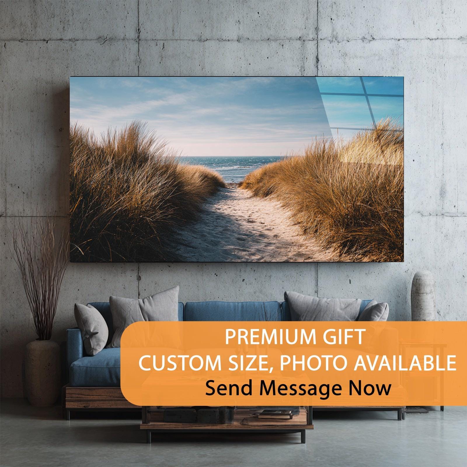Living room with a large wall art of a beach scene, sofa, and decorative elements.