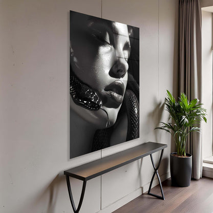 Modern interior with a large black and white portrait on the wall, a bench, and a plant.