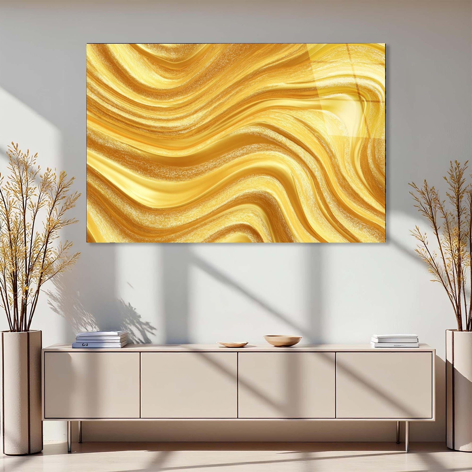 Modern interior with a gold abstract painting above a light-colored cabinet.