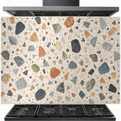 Terrazzo mosaic tempered glass backsplash installed behind a modern gas stove in a contemporary kitchen.