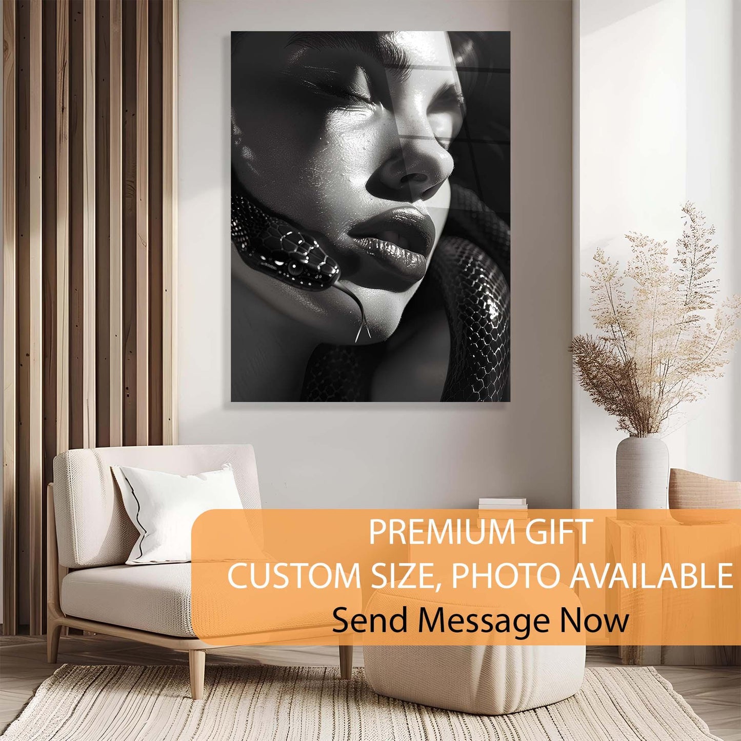 Black and white portrait of a woman on a wall above a beige sofa with decorative elements.