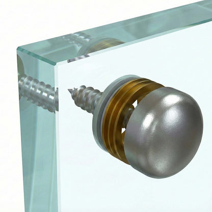 Light bulb with a screw base on a glass backsplash